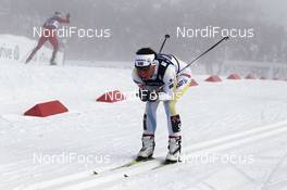 03.03.2011, Oslo, Norway (NOR): Charlotte Kalla (SWE), Fischer, Salomon, Swix, Craft with Marit Bjoergen (NOR), Fischer, Rottefella, Swix in the background already leaving the stadium - FIS nordic world ski championships, cross-country, 4x5km women, Oslo (NOR). www.nordicfocus.com. © Hemmersbach/NordicFocus. Every downloaded picture is fee-liable.