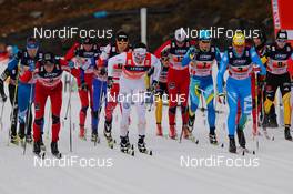 20.11.2011, Sjusjoen, Norway (NOR): in the first row (l-r) Eldar Roenning (NOR), Rossignol, Swix, Rottefella, Marcus Hellner (SWE), Fischer, Swix, Salomon, Craft and Pietro Piller Cottrer (ITA), Rossignol, One Way, Rottefella, Yoko  - FIS world cup cross country, 4x10km men, Sjusjoen (NOR). www.nordicfocus.com. Â© Laiho/NordicFocus. Every downloaded picture is fee-liable.