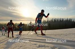20.11.2011, Sjusjoen, Norway (NOR): Sergey Novikov (RUS), Fischer, Swix, Alpina, Rottefella, Adidas followed by Finn Haagen Krogh (NOR), Fischer, Swix, Alpina, Rottefella and Maxim Vylegzhanin (RUS), Fischer, Swix, Alpina, Rottefella, Adidas  - FIS world cup cross country, 4x10km men, Sjusjoen (NOR). www.nordicfocus.com. Â© Laiho/NordicFocus. Every downloaded picture is fee-liable.