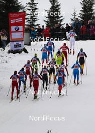 20.11.2011, Sjusjoen, Norway (NOR): group of skiers climbing the first hill  - FIS world cup cross country, 4x5km women, Sjusjoen (NOR). www.nordicfocus.com. Â© Laiho/NordicFocus. Every downloaded picture is fee-liable.