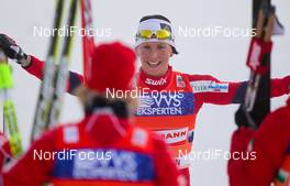 20.11.2011, Sjusjoen, Norway (NOR): Marit Bjoergen (NOR), Fischer, Swix, Rottefella and the other skiers celebrate the victory  - FIS world cup cross country, 4x5km women, Sjusjoen (NOR). www.nordicfocus.com. Â© Laiho/NordicFocus. Every downloaded picture is fee-liable.