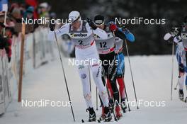 25.11.2011, Kuusamo, Finland (FIN): Jesper Modin (SWE), Fischer, Salomon, Swix, Craft leads Dario Cologna (SUI), Fischer, Rottefella, Alpina, Swix, ODLO, Casco - FIS world cup cross-country, individual sprint, Kuusamo (FIN). www.nordicfocus.com. © Manzoni/NordicFocus. Every downloaded picture is fee-liable.