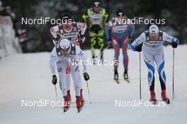 25.11.2011, Kuusamo, Finland (FIN): Teodor Peterson (SWE), Rossignol, Rottefella, Alpina, OneWay leads Peeter Kummel (EST), Fischer, Rottefella and Len Valjas (CAN) - FIS world cup cross-country, individual sprint, Kuusamo (FIN). www.nordicfocus.com. © Manzoni/NordicFocus. Every downloaded picture is fee-liable.