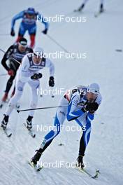 25.11.2011, Kuusamo, Finland (FIN): Kein Einaste (EST), Fischer, Swix, leads ahead of Jesper Modin (SWE), Fischer, Salomon, Swix, Craft, Casco and Dario Cologna (SUI), Fischer, Rottefella, Alpina, Swix, Odlo  - FIS world cup cross-country, individual sprint, Kuusamo (FIN). www.nordicfocus.com. © Felgenhauer/NordicFocus. Every downloaded picture is fee-liable.