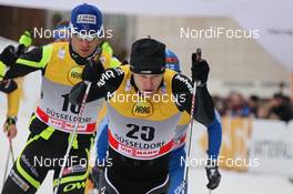 03.12.2011, Duesseldorf, Germany (GER): group, in front: Joeri Kindschi (SUI), Atomic, Swix, Odlo, behind Roddy Darragon (FRA), Salomon, One Way  - FIS world cup cross-country, individual sprint, Duesseldorf (GER). www.nordicfocus.com. © Hemmersbach/NordicFocus. Every downloaded picture is fee-liable.