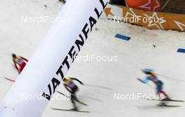 04.12.2011, Duesseldorf, Germany (GER): feature: skiers under the Vattenfall arc - FIS world cup cross-country, team sprint, Duesseldorf (GER). www.nordicfocus.com. © Hemmersbach/NordicFocus. Every downloaded picture is fee-liable.