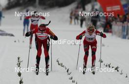 30.12.2011, Oberhof, Germany (GER): finish, l-r: Justyna Kowalczyk (POL), Fischer, Rottefella, Swix, Therese Johaug (NOR), Fischer, Salomon, Swix, behind Marit Bjoergen (NOR), Fischer, Rottefella, Swix  - FIS world cup cross-country, tour de ski, pursuit women handicap start, Oberhof (GER). www.nordicfocus.com. © Hemmersbach/NordicFocus. Every downloaded picture is fee-liable.