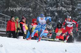 30.12.2011, Oberhof, Germany (GER): l-r: Aino Kaisa Saarinen (FIN), Rossignol, Rottefella, Alpina, One Way, Craft and Marit Bjoergen (NOR), Fischer, Rottefella, Swix  - FIS world cup cross-country, tour de ski, pursuit women handicap start, Oberhof (GER). www.nordicfocus.com. © Hemmersbach/NordicFocus. Every downloaded picture is fee-liable.