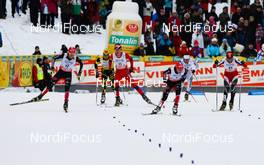 12.03.2011, Lahti, Finland (FIN): big group of skiers coming to the finish, in front (l-r) Johannes Rydzek (GER), Fischer, Swix, Rottefella, Adidas and Eric Frenzel (GER), Fischer, Leki, Salomon, Adidas  - FIS world cup nordic combined, individual gundersen HS130/10km, Lahti (FIN). www.nordicfocus.com. © Laiho/NordicFocus. Every downloaded picture is fee-liable.