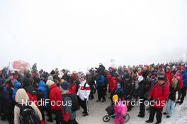 02.03.2011, Oslo, Norway (NOR): spectators on the way to the stadium and the foggy sight towards the jumping hill  - FIS nordic world ski championships, nordic combined, individual gundersen HS134/10km, Oslo (NOR). www.nordicfocus.com. © Laiho/NordicFocus. Every downloaded picture is fee-liable.