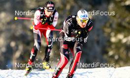 04.03.2011, Oslo, Norway (NOR):  Tino Edelmann (GER), Madshus, Leki, Rottefella, Adidas followed by Mario Stecher (AUT), Fischer, Leki, Rottefella, Loeffler - FIS nordic world ski championships, nordic combined, team HS134/4x5km, Oslo (NOR). www.nordicfocus.com. © Laiho/NordicFocus. Every downloaded picture is fee-liable.