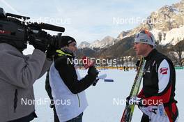 09.12.2011, Ramsau, Austria (AUT): Bernhard Gruber (AUT), Fischer, Rottefella, Loeffler, Leki in ORF interview - FIS world cup nordic combined, training, Ramsau (AUT). www.nordicfocus.com. © Hemmersbach/NordicFocus. Every downloaded picture is fee-liable.