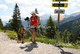 06.07.2011, Ehrwald, Austria (AUT): (l-r) Matthias Dippacher (GER) and a camera man  - Salomon 4 Trails, trail running, 38km, Garmisch-Partenkirchen (GER) - Ehrwald (AUT). www.nordicfocus.com. Â© NordicFocus. Every downloaded picture is fee-liable.