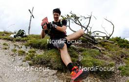 07.07.2011, Ehrwald, Austria (AUT): a runners drops the stones from his shoe on the top of a hill  - Salomon 4 Trails, trail running, 43km, Ehrwald (AUT) - Imst (AUT). www.nordicfocus.com. Â© NordicFocus. Every downloaded picture is fee-liable.