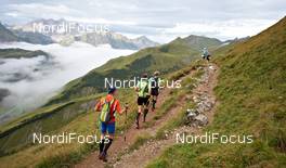04.09.2011, Schruns, Austria (AUT): a group of racers in the beautiful scenery of Vorarlberg   - Gore Tex Transalpine Run, trail running, 53km, Hirschegg (AUT) - Schruns (AUT). www.nordicfocus.com. © NordicFocus. Every downloaded picture is fee-liable.