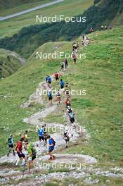 04.09.2011, Schruns, Austria (AUT): a long row of racers on the way down   - Gore Tex Transalpine Run, trail running, 53km, Hirschegg (AUT) - Schruns (AUT). www.nordicfocus.com. © NordicFocus. Every downloaded picture is fee-liable.