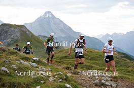 04.09.2011, Schruns, Austria (AUT): Seppi Neuhauser (GER), TEAM SALOMON and Gaby Steigmeier (SUI), TEAM SALOMON lead a small group   - Gore Tex Transalpine Run, trail running, 53km, Hirschegg (AUT) - Schruns (AUT). www.nordicfocus.com. © NordicFocus. Every downloaded picture is fee-liable.
