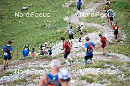 04.09.2011, Schruns, Austria (AUT): a long row of racers on the way down   - Gore Tex Transalpine Run, trail running, 53km, Hirschegg (AUT) - Schruns (AUT). www.nordicfocus.com. © NordicFocus. Every downloaded picture is fee-liable.
