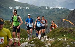 04.09.2011, Schruns, Austria (AUT): a big group arrives at the first top of the day   - Gore Tex Transalpine Run, trail running, 53km, Hirschegg (AUT) - Schruns (AUT). www.nordicfocus.com. © NordicFocus. Every downloaded picture is fee-liable.
