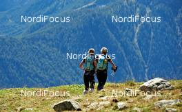 06.09.2011, Scuol, Switzerland (SUI): l-r: Sanna Kullberg (FIN), TEAM BUFF THERMOCOOL, Maija Oravamaki (FIN), TEAM BUFF THERMOCOOL    - Gore Tex Transalpine Run, trail running, 40km, Galtuer (AUT) - Scuol (SUI). www.nordicfocus.com. © NordicFocus. Every downloaded picture is fee-liable.
