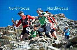 06.09.2011, Scuol, Switzerland (SUI): Kathrin Hoefler (GER), Team Craft Women, overtakes some slower men   - Gore Tex Transalpine Run, trail running, 40km, Galtuer (AUT) - Scuol (SUI). www.nordicfocus.com. © NordicFocus. Every downloaded picture is fee-liable.