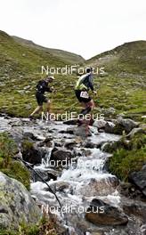 08.09.2011, Mals, Italy (ITA): slower racers near Schlinigpass   - Gore Tex Transalpine Run, trail running, 39km, Scuol (SUI) - Mals (ITA). www.nordicfocus.com. © NordicFocus. Every downloaded picture is fee-liable.