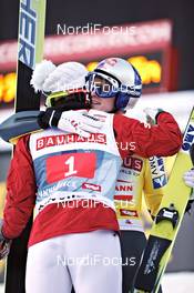 03.01.2011, Innsbruck, Austria (AUT): Tom Hilde (NOR), Fischer, gives congratulations to Thomas Morgenstern (AUT), Fischer  - FIS world cup ski jumping, four hills tournament, individual HS130, Innsbruck (AUT). www.nordicfocus.com. Â© Felgenhauer/NordicFocus. Every downloaded picture is fee-liable.