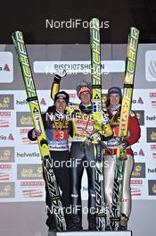 06.01.2011, Bischofshofen, Austria (AUT): l-r: Simon Ammann (SUI), Fischer, Thomas Morgenstern (AUT), Fischer, Tom Hilde (NOR), Fischer, on the podium of Four Hills Tournament overall - FIS world cup ski jumping, four hills tournament, individual HS140, Bischofshofen (AUT). www.nordicfocus.com. Â© Felgenhauer/NordicFocus. Every downloaded picture is fee-liable.