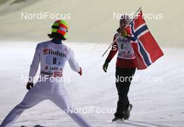 12.03.2011, Lahti, Finland (FIN):  (r-l) Johan Remen Evensen (NOR), Elan tried to give the falg to Tom Hilde (NOR), Fischer - FIS world cup ski jumping, team HS130, Lahti (FIN). www.nordicfocus.com. © Laiho/NordicFocus. Every downloaded picture is fee-liable.