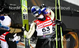 03.03.2011, Oslo, Norway (NOR):  (l-r) Thomas Morgenstern (AUT), Fischer congratulates the world champion Gregor Schlierenzauer (AUT), Fischer  - FIS nordic world ski championships, ski jumping, individual HS134, Oslo (NOR). www.nordicfocus.com. © Laiho/NordicFocus. Every downloaded picture is fee-liable.