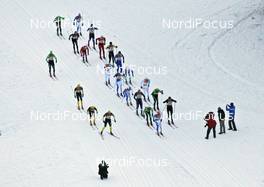 30.01.2011, Val di Fiemme / Val di Fassa, Italy (ITA): helicopter view, the chasing group, passing spectators, in front Bruno Carrara (ITA)  - FIS Marathon Cup Marcialonga, Val di Fiemme / Val di Fassa (ITA). www.nordicfocus.com. © Hemmersbach/NordicFocus. Every downloaded picture is fee-liable.