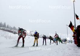 08.01.2012, Oberhof, Germany (GER): Tora Berger (NOR), Fischer, Rottefella, Odlo, Magdalena Neuner (GER), Fischer, Rottefella, Swix, adidas, Toko, Darya Domracheva (BLR), Fischer, Rottefella, Leki - IBU world cup biathlon, mass women, Oberhof (GER). www.nordicfocus.com. © Manzoni/NordicFocus. Every downloaded picture is fee-liable.
