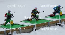 05.02.2012, Holmenkollen, Norway (NOR):  (l-r) Darya Domracheva (BLR), Fischer, Rottefella, Swix, Miriam Goessner (GER), Fischer, Salomon, Swix, adidas and Olga Zaitseva (RUS), Madshus, Rottefella, Alpina, adidas - IBU world cup biathlon, mass women, Holmenkollen (NOR). www.nordicfocus.com. Â© Laiho/NordicFocus. Every downloaded picture is fee-liable.