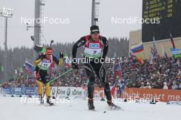 17.03.2012, Khanty-Mansiysk, Russia (RUS): Simon Hallenbarter (SUI), Rossignol, Rottefella, KV+, ODLO, Alpina leads Florian Graf (GER), Rossignol, Rottefella, Leki, adidas - IBU world cup biathlon, pursuit men, Khanty-Mansiysk (RUS). www.nordicfocus.com. © Manzoni/NordicFocus. Every downloaded picture is fee-liable.