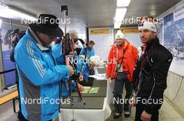 06.03.2012, Ruhpolding, Germany (GER): Jean Philippe Leguellec (CAN), Rossignol, Rottefella, Swix at the riffle control - IBU world championships biathlon, individual men, Ruhpolding (GER). www.nordicfocus.com. © Manzoni/NordicFocus. Every downloaded picture is fee-liable.