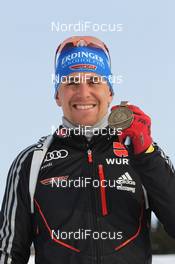 15.03.2012, Ruhpolding, Germany (GER): Michael Greis (GER), Madshus, Rottefella, OneWay, adidas - IBU world championships biathlon, medals, Ruhpolding (GER). www.nordicfocus.com. © Manzoni/NordicFocus. Every downloaded picture is fee-liable.