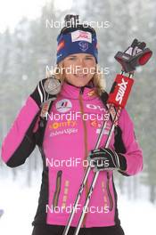 16.03.2012, Ruhpolding, Germany (GER): Anais Bescond (FRA), Madshus, Rottefella, Swix, OneWay - IBU world championships biathlon, medals, Ruhpolding (GER). www.nordicfocus.com. © Manzoni/NordicFocus. Every downloaded picture is fee-liable.