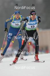 04.03.2012, Ruhpolding, Germany (GER): Selina Gasparin (SUI), Rossignol, Rottefella, Alpina, Leki, ODLO, Anna Maria Nilsson (SWE), Madshus, Rottefella, Leki, adidas - IBU world championships biathlon, pursuit women, Ruhpolding (GER). www.nordicfocus.com. © Manzoni/NordicFocus. Every downloaded picture is fee-liable.