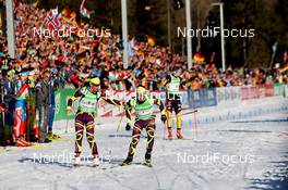 01.03.2012, Ruhpolding, Germany (GER): Marie Dorin (FRA), Rossignol, Rottefella, OneWay, Simon Fourcade (FRA), Fischer, Rottefella, Rossignol, Swix, Odlo - IBU world championships biathlon, relay mixed, Ruhpolding (GER). www.nordicfocus.com. © Manzoni/NordicFocus. Every downloaded picture is fee-liable.