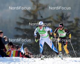 01.03.2012, Ruhpolding, Germany (GER): Kadri Lehtla (EST), Fischer, Rottefella, Leki leads Andrea Henkel (GER), Fischer, Rottefella, Swix, adidas, Toko - IBU world championships biathlon, relay mixed, Ruhpolding (GER). www.nordicfocus.com. © Manzoni/NordicFocus. Every downloaded picture is fee-liable.