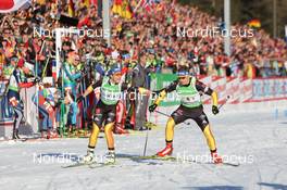 01.03.2012, Ruhpolding, Germany (GER): Magdalena Neuner (GER), Fischer, Rottefella, Swix, adidas, Toko, Andreas Birnbacher (GER), Fischer, Rottefella, Alpina, Leki, adidas - IBU world championships biathlon, relay mixed, Ruhpolding (GER). www.nordicfocus.com. © Manzoni/NordicFocus. Every downloaded picture is fee-liable.
