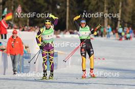 01.03.2012, Ruhpolding, Germany (GER): Simon Fourcade (FRA), Fischer, Rottefella, Rossignol, Swix, Odlo, Andreas Birnbacher (GER), Fischer, Rottefella, Alpina, Leki, adidas - IBU world championships biathlon, relay mixed, Ruhpolding (GER). www.nordicfocus.com. © Manzoni/NordicFocus. Every downloaded picture is fee-liable.