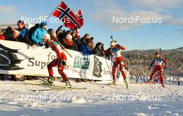 18.11.2012, Beitostoelen, Norway (NOR): Tiril Eckhoff (NOR), Fischer, Swix, Rottefella, Odlo followed by Elise Ringen, (NOR), Fischer, Rottefella, Odlo and Fanny Wellestrand Horn (NOR), Madshus, Swix, Alpina, Rottefella  - Beitosprinten Biathlon, mass women, Beitostoelen (NOR). www.nordicfocus.com. © Laiho/NordicFocus. Every downloaded picture is fee-liable.