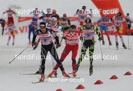 01.01.2012, Oberstdorf, Germany (GER): group, in front Dario Cologna (SUI), Fischer, Rottefella, Alpina, Swix, Odlo, behind Petter Northug (NOR), Fischer, Rottefella, Alpina, Ski Go, Swix, behind l-r: Marcus Hellner (SWE), Fischer, Salomon, Exel, Craft and Maurice Manificat (FRA), Fischer, Swix, One Way  - FIS world cup cross-country, tour de ski, skiathlon men, Oberstdorf (GER). www.nordicfocus.com. © Hemmersbach/NordicFocus. Every downloaded picture is fee-liable.