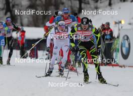 01.01.2012, Oberstdorf, Germany (GER): group, in front Maurice Manificat (FRA), Fischer, Swix, One Way, behind Emil Joensson (SWE), Fischer, Salomon, Craft, Swix  - FIS world cup cross-country, tour de ski, skiathlon men, Oberstdorf (GER). www.nordicfocus.com. © Hemmersbach/NordicFocus. Every downloaded picture is fee-liable.