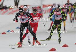 01.01.2012, Oberstdorf, Germany (GER): group, in front Dario Cologna (SUI), Fischer, Rottefella, Alpina, Swix, Odlo, behind Petter Northug (NOR), Fischer, Rottefella, Alpina, Ski Go, Swix  and Maurice Manificat (FRA), Fischer, Swix, One Way  - FIS world cup cross-country, tour de ski, skiathlon men, Oberstdorf (GER). www.nordicfocus.com. © Hemmersbach/NordicFocus. Every downloaded picture is fee-liable.