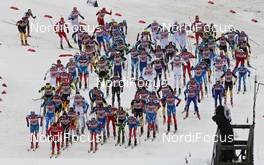 01.01.2012, Oberstdorf, Germany (GER): start of the race, in front Petter Northug (NOR), Fischer, Rottefella, Alpina, Ski Go, Swix, behind l-r: Maxim Vylegzhanin (RUS), Fischer, Rottefella, Alpina, Swix, adidas, Dario Cologna (SUI), Fischer, Rottefella, Alpina, Swix, Odlo, Dimitri Japarov (RUS), Fischer, Rottefella, Alpina, Swix, Adidas  - FIS world cup cross-country, tour de ski, skiathlon men, Oberstdorf (GER). www.nordicfocus.com. © Hemmersbach/NordicFocus. Every downloaded picture is fee-liable.