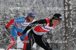 04.01.2012, Cortina-Toblach, Italy (ITA): l-r: Alexander Legkov (RUS), Rossignol, Rottefella, Swix, adidas, Dario Cologna (SUI), Fischer, Rottefella, Alpina, Swix, Odlo  - FIS world cup cross-country, tour de ski, individual sprint, Cortina-Toblach (ITA). www.nordicfocus.com. © Hemmersbach/NordicFocus. Every downloaded picture is fee-liable.