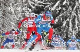 04.01.2012, Cortina-Toblach, Italy (ITA): in front Ilia Chernousov (RUS), Rossignol, Rottefella, Swix, adidas, behind Petter Northug (NOR), Fischer, Rottefella, Alpina, Ski Go, Swix   - FIS world cup cross-country, tour de ski, individual sprint, Cortina-Toblach (ITA). www.nordicfocus.com. © Hemmersbach/NordicFocus. Every downloaded picture is fee-liable.