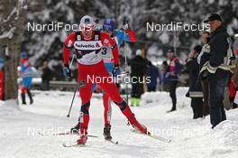 05.01.2012, Cortina-Toblach, Italy (ITA): Petter Northug (NOR), Fischer, Rottefella, Alpina, Ski Go, Swix  ahead of Alexander Legkov (RUS), Rossignol, Rottefella, Swix, adidas  - FIS world cup cross-country, tour de ski, pursuit men, Cortina-Toblach (ITA). www.nordicfocus.com. © Hemmersbach/NordicFocus. Every downloaded picture is fee-liable.